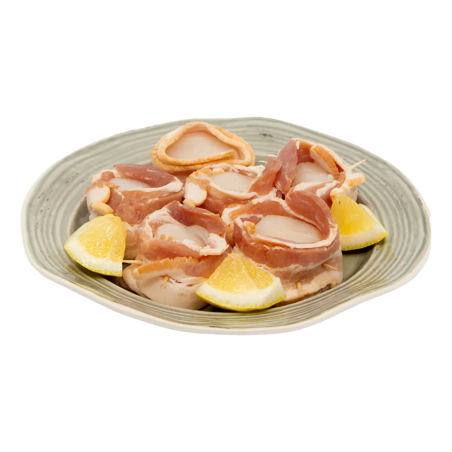 A plate of bacon wrapped sea scallops is arranged with bright lemon wedges, creating a simple, appetizing meal on a pale ceramic dish.