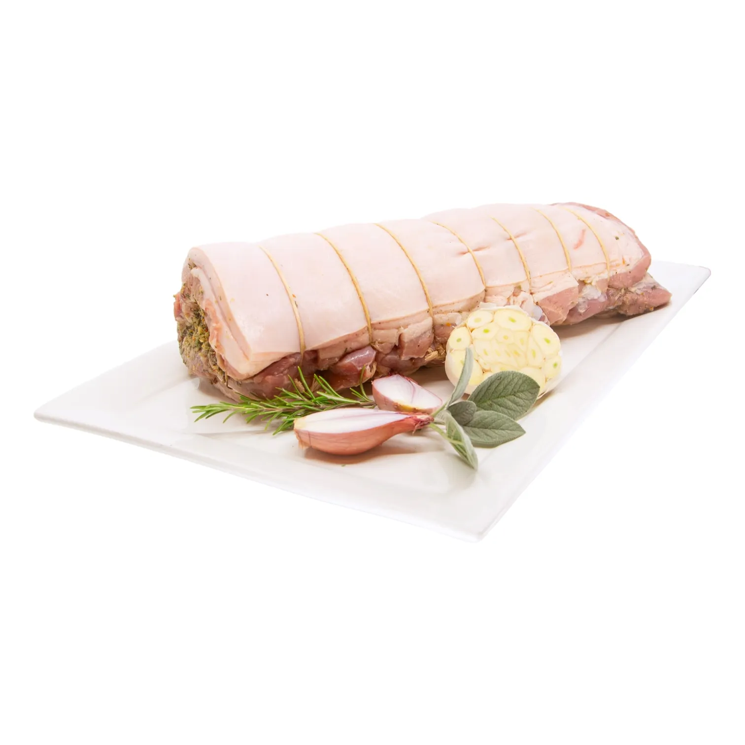 An herb-stuffed rolled pork roast tied with string rests on a white platter with garlic, shallot, rosemary, and sage, styled as fresh and appetizing.