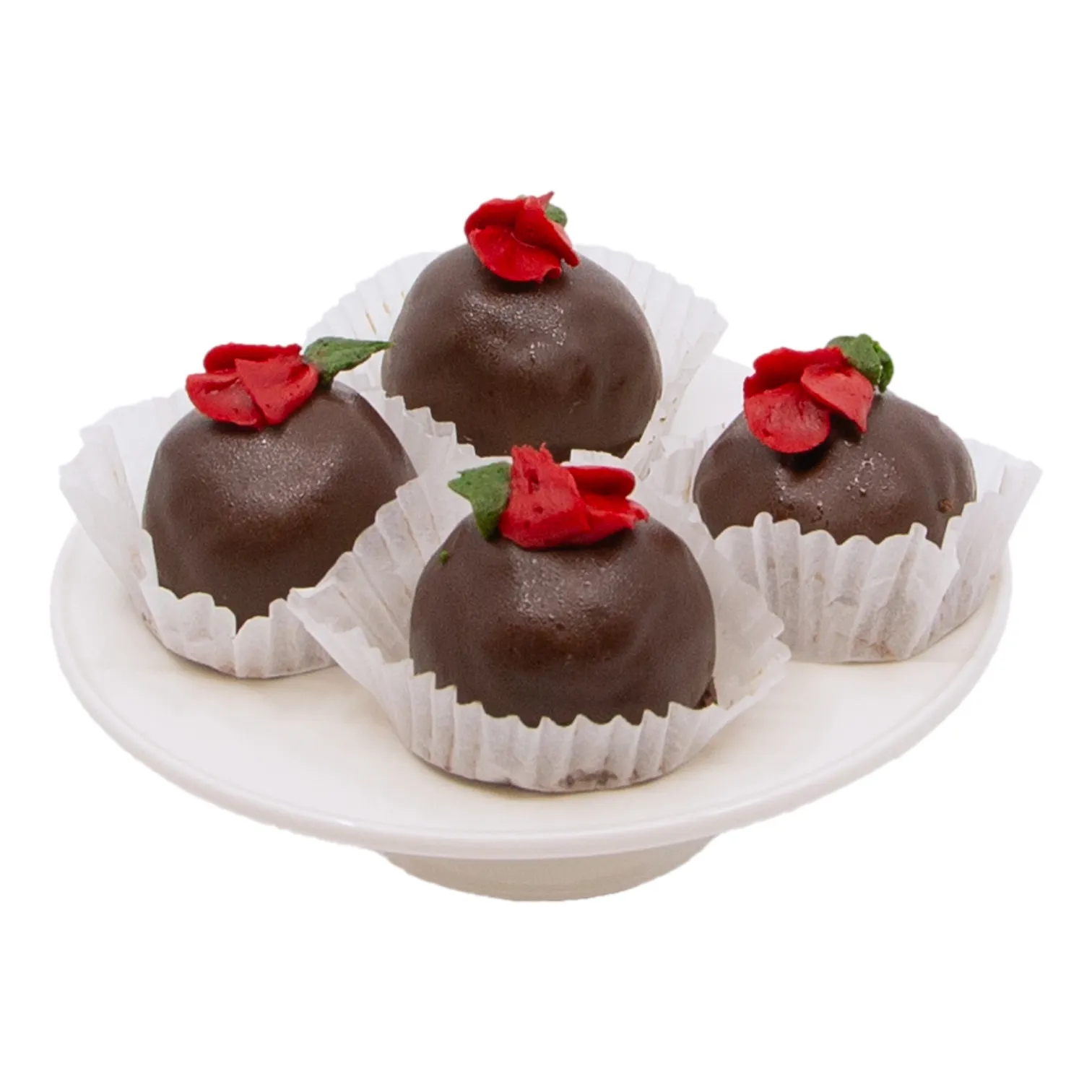 rum_balls_44281 Four round chocolate rum ball truffles topped with red rose-shaped decorations sit in white paper cups on a white plate, creating an elegant, festive dessert display.