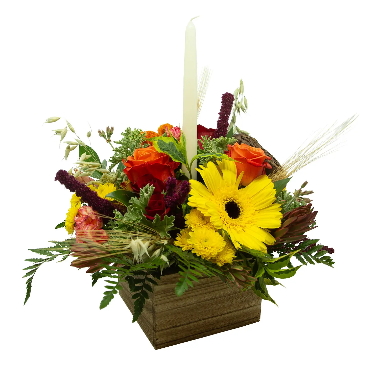 Autumn floral arrangement in a rustic wooden box, featuring bright yellow gerbera daisies, orange roses, burgundy blooms, greenery, and a tall white candle; warm, cheerful tone.