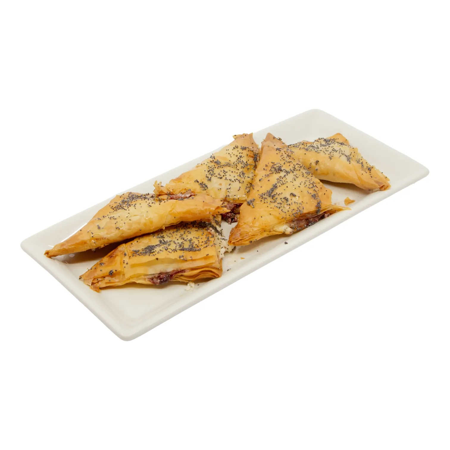 Golden triangular phyllo pastries sprinkled with black seeds are arranged on a long white platter, offering a crisp, savory appetizer.