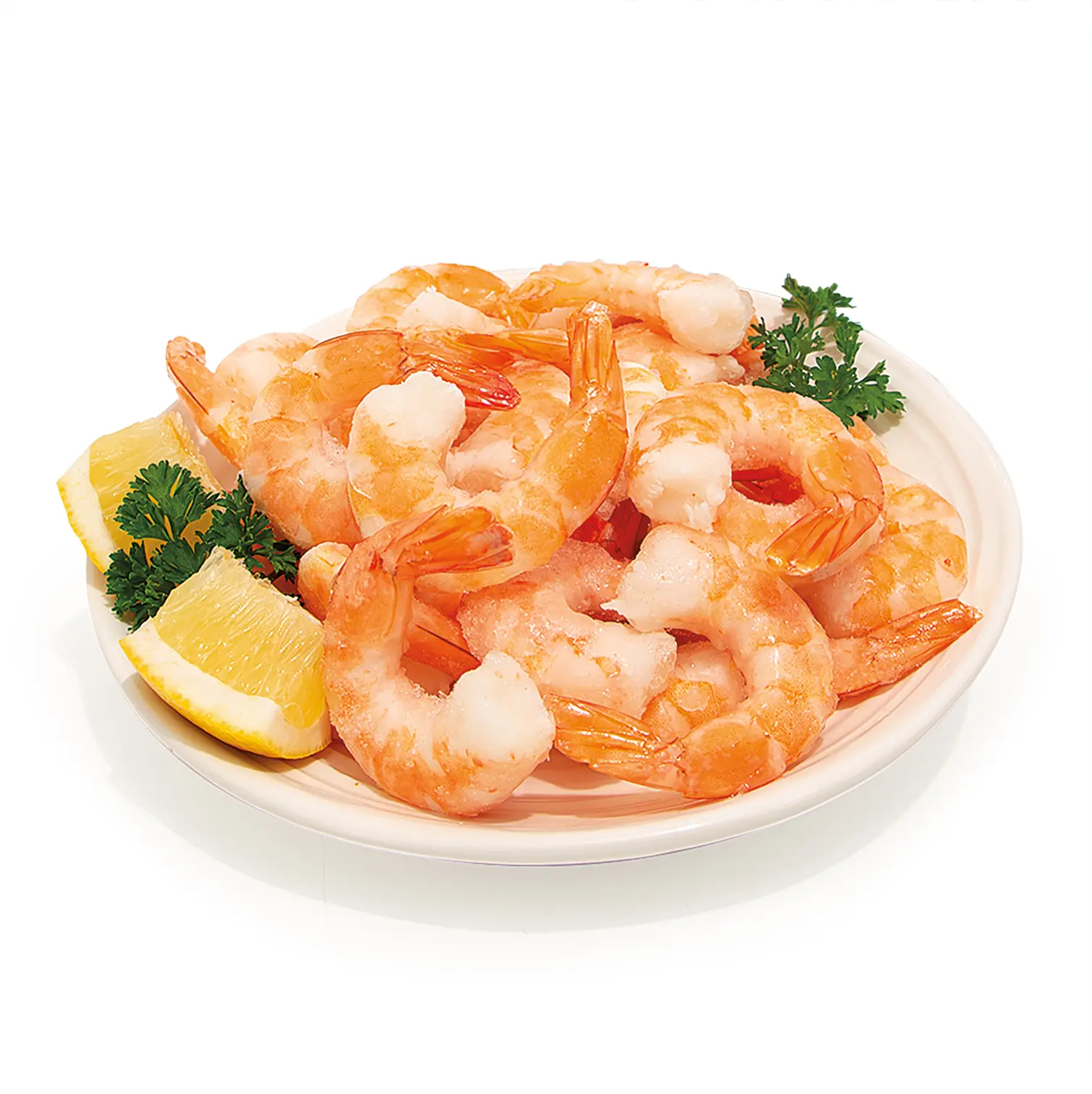 A white plate piled with pink cooked shrimp, garnished with lemon wedges and fresh parsley.