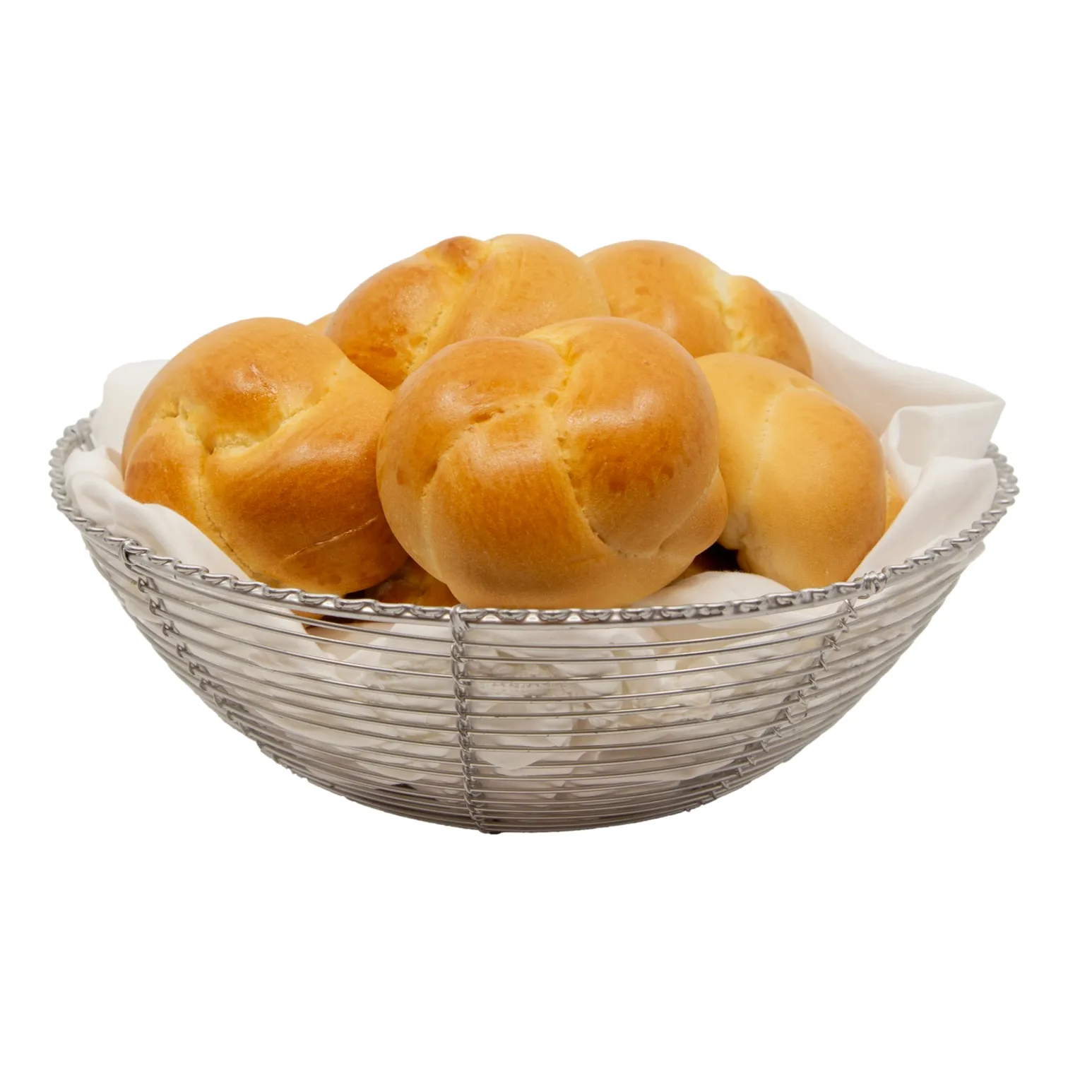 A silver wire basket lined with white cloth holds several golden-brown round bread rolls, suggesting a warm, inviting meal.