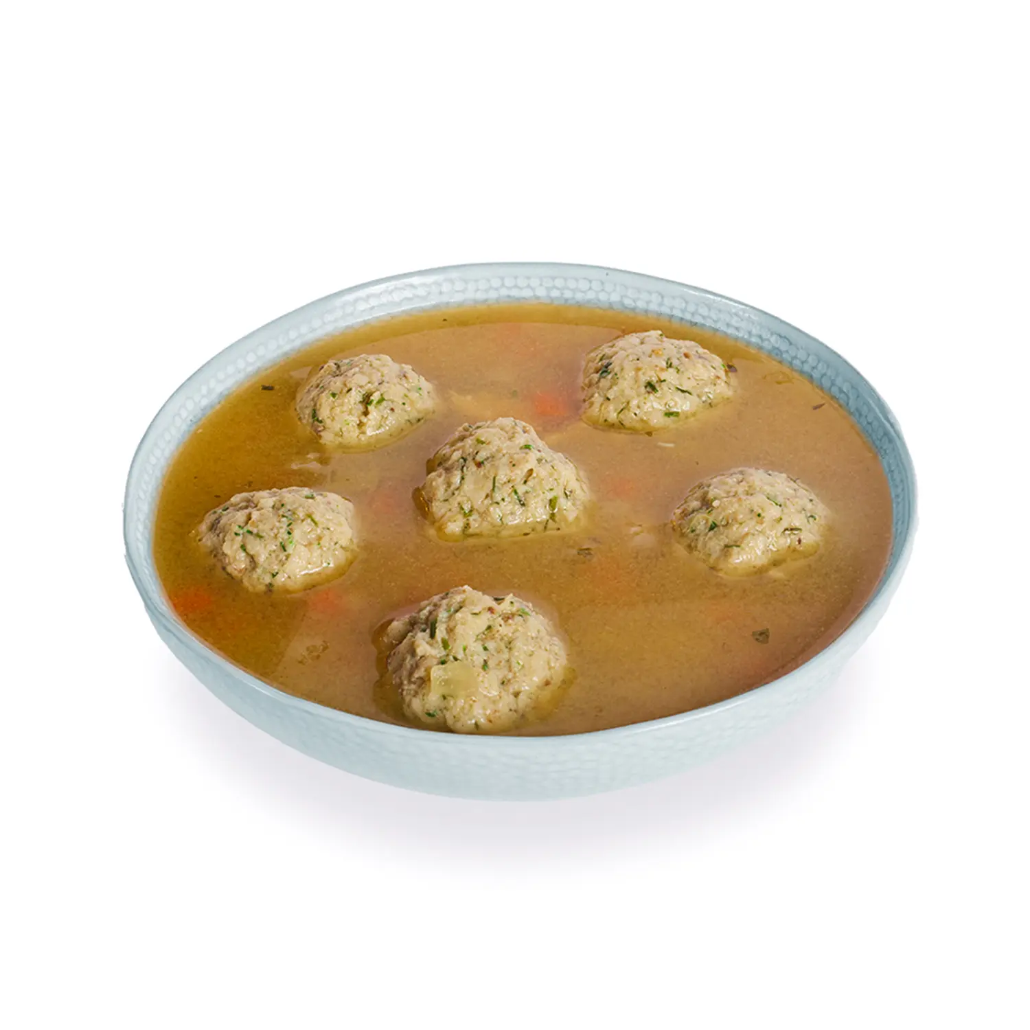 A pale blue bowl holds golden-brown broth with six matzoh balls floating on top.