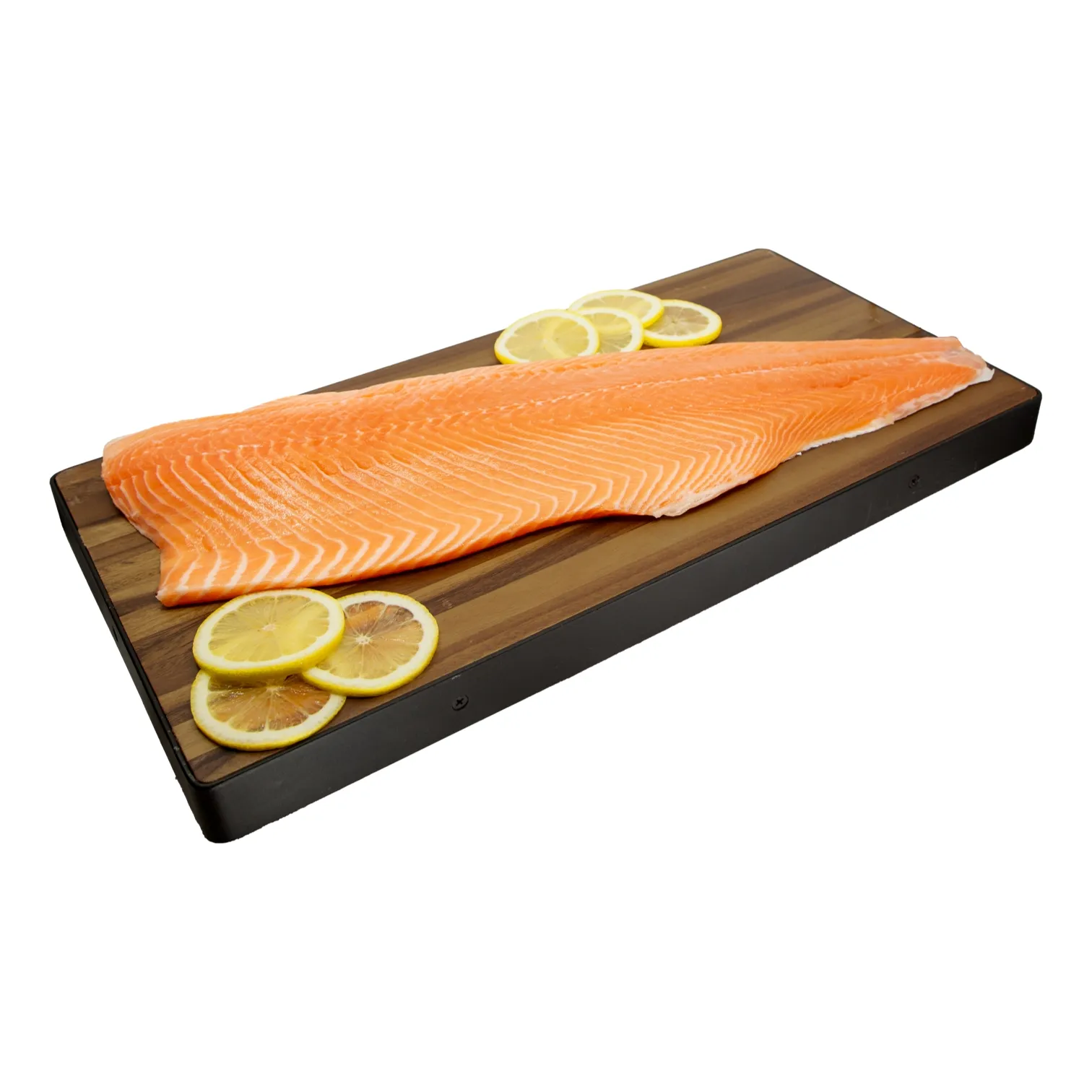 A fresh Norwegian king salmon fillet rests on a dark wooden serving board, garnished with lemon slices.