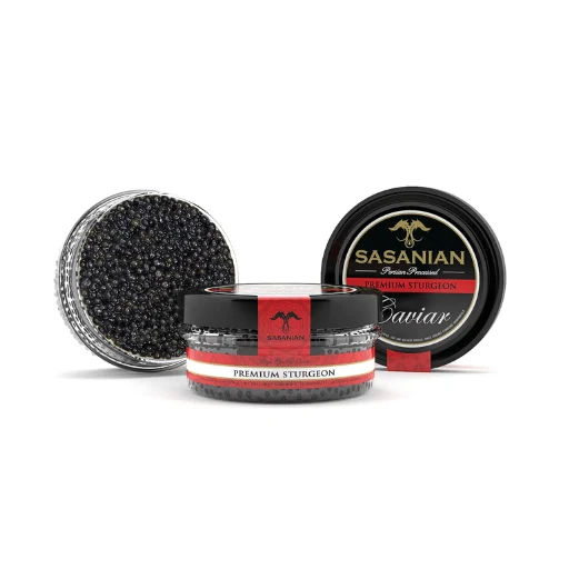 sasanian_siberian_ostera_caviar Three Sasaniān premium sturgeon caviar tins on a white background: one open tin reveals glossy black caviar, beside two labeled lids.